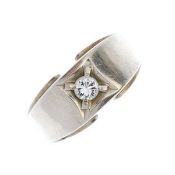 A diamond single-stone 14K White gold ring. The brilliant-cut diamond, within a square-shape