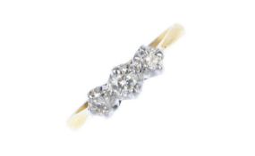 A mid 20th century trilogy ring set in 18 carat gold, three graduated brilliant cut diamonds,