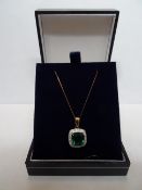 2 x 9 Carat Yellow Gold Chains With Diamond and Synthetic Green Stone(emerald style) pendants.
