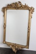 Wandspiegel, 19. Jahrh., Barockstil, mit Muschel u. Rankenwerk, Stuck, org. vergoldet,Spiegelglas