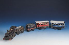 Dampflok m. Federwerk, wohl 1930er Jahre, inkl. Tender, zwei Personenwagen plus offenerKohlewagen.