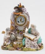 A Continental porcelain figural mantel clock: modelled with a seated barefoot girl with an open