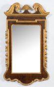 An early 18th Century walnut and carved gilt wood wall mirror:,