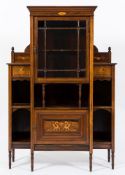 An Edwardian rosewood and marquetry breakfront display cabinet:,