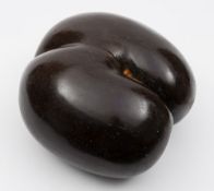 A large polished Coco-da-mere: of plain deep chocolate brown patination, 34cm. long.