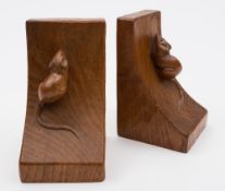 A pair of Mouseman light oak bookends, by Robert Thompson of Kilburn: 16cm. high.