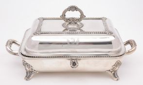 A plated warming dish and cover: crested, with gadrooned borders, reeded loop handle to the cover,