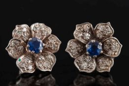 A pair of sapphire and diamond floral cluster earrings: each with a central circular sapphire 4.
