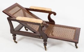 An early 19th Century mahogany adjustable armchair:,
