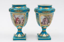 A pair of French porcelain vases in the Sèvres manner: of cartouche foliate moulded profile  set on