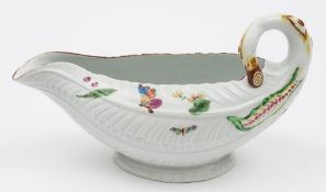 A Worcester cos lettuce sauceboat: moulded with overlapping leaves and branch handle,