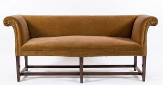 A late 19th Century mahogany frame scroll end settee:, with a rectangular stuff over back,