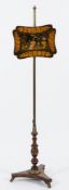 A Regency rosewood and brass polescreen:, with painted and pen work decorated wood panel,