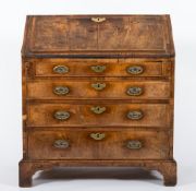 An 18th Century walnut veneer, cross and feather banded bureau:,