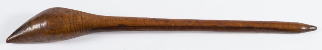 A West African tribal club: the head of pointed conical form to a slender tapering shaft, 54cm.