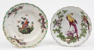 A Chelsea plate and one similar: the first with feather moulded rim and painted with vignelles of