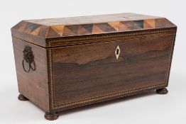 A 19th century rosewood and marquetry tea caddy: of sarcophagus outline.