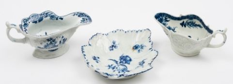 Two Worcester blue and white sauceboats and a leaf dish: the first sauceboat of high footed form