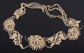 A mother of pearl and seed pearl necklace: approximately 41cm total length, in fitted case.