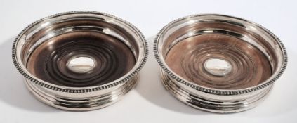 A pair of George III silver wine coasters, maker Rebecca Emes & Edward Barnard I, London,