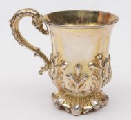 A 19th century silver gilt mug, all marks worn and illegible: with foliate decoration to the sides,