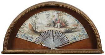A 19th century Continental mother-of-pearl fan: the paper leaf with painted decoration of figures