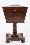 An early Victorian mahogany sarcophagus shaped cellarette:,