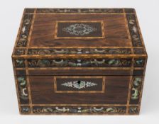 A Victorian rosewood and inlaid dressing box: the hinged lid inlaid with mother-of-pearl and having