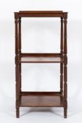 A Regency mahogany three-tier whatnot:, on turned uprights,