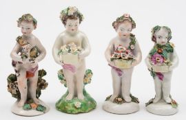 A Bow figure of a putto and three similar Derby putti: the first with head and body garlanded with