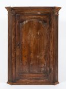 An 18th Century yew-wood hanging corner cupboard:,