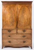 A George III mahogany linen press:, the upper part with a moulded dentil cornice,