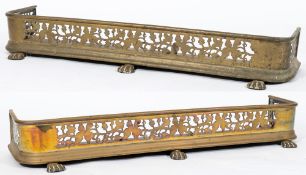 A pair of early 19th Century pierced brass rectangular fenders:,