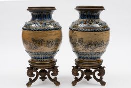 A pair of Doulton Lambeth lamp bases decorated by Hannah Barlow: of oviform with cast bronze base