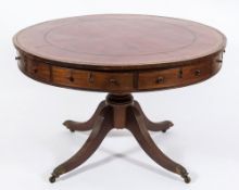 A Regency mahogany and inlaid circular drum top library table:, bordered with ebony lines,