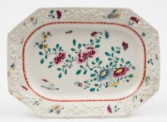 A Bow octagonal serving dish: the rim applied with prunus sprigs,