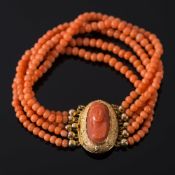 A coral relief portrait and coral bead five-string bracelet: the five strings with beads