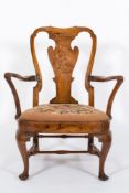An early 18th Century elm low open armchair:,
