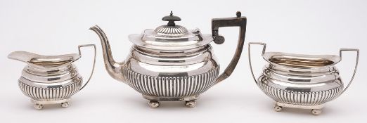 An Edward VII silver three-piece tea service, maker John & William Deakin, Sheffield,