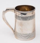 A George III silver mug, maker Solomon Houghman, London, 1793: of plain cylindrical tapering form,