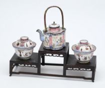 A 19th century Canton enamel kettle with two bowls and covers: the kettle of quatrefoil outline
