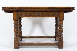 An oak draw-leaf dining table in the 17th Century taste:,