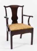 A George II mahogany elbow chair:, the back with serpentine top rail and solid central splat,