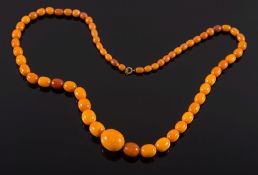 A graduated amber coloured bead,
