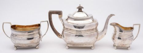 A matched three-piece silver tea service, various maker's and dates: crested and monogrammed,