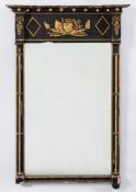 An early 19th Century ebonised and gilt gesso pier mirror:,