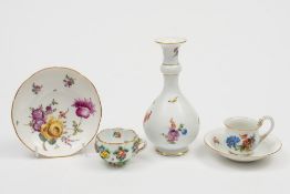 A late Meissen bottle vase/guglet and four similar items: the guglet with garlic neck and painted