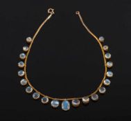 A moonstone fringe necklace: with circular moonstone graduated from 7mm diameter to 10.