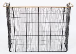 A 19th Century brass rail and blackened wire mesh nursery fender:, of curved outline,