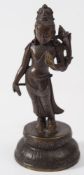 An Indo-Chinese bronze figure, probably Avalokiteshvara: wearing traditional robes,
